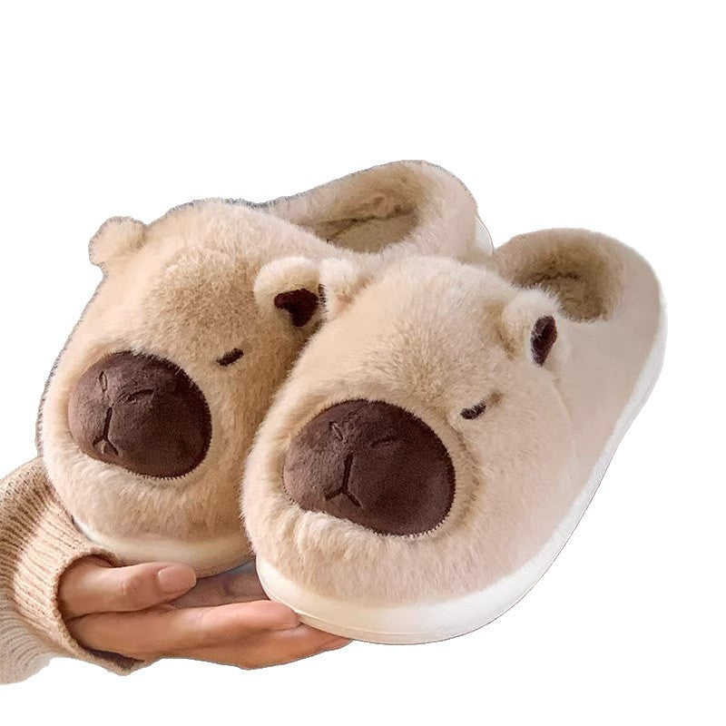 A pair of cozy capybara slippers featuring a plush design, perfect for indoor relaxation and comfort.
