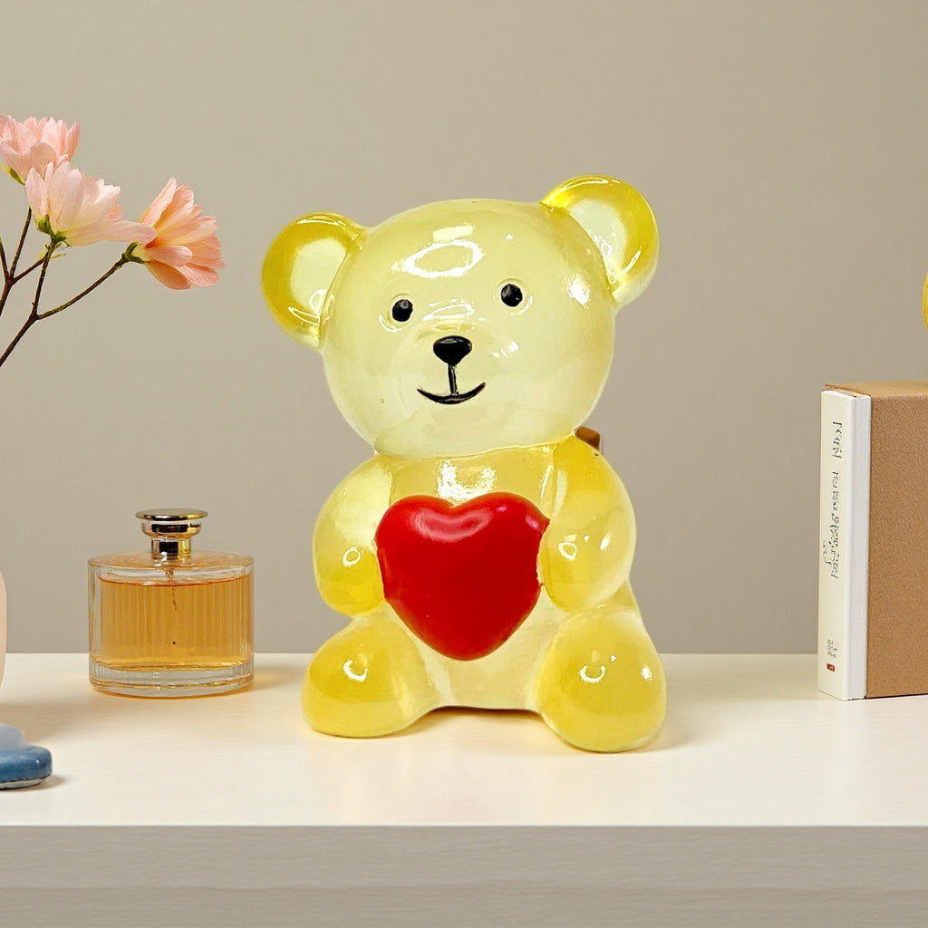 yellow resin bear ornament on table